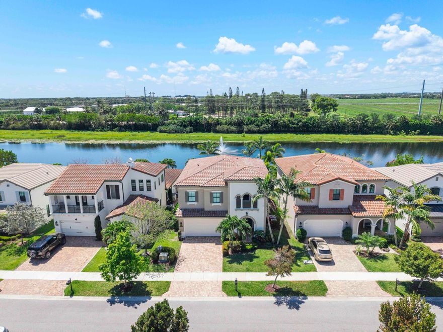 Walk into a double doorentry model home, This 2 story 4 bedroom-3.5 bathroom with pretty fountain & lakeview home is the only Mediterranean elevation like this in the community, Additional upstairs covered balcony & downstairs patio give great outdoor views of the fountain, lake & serene swishing palms, 48" porcelain flooring & luxury chandeliers adorn this masterpiece, Real wood luxury staircase & wrought iron banister with roof to ground floor crystal chandelier centerpiece, Enter the wide foyer into the open floorplan kitchen & great room- center island of real wooden cabinetry & granite countertops, basket weave backsplash pop the view with lots of storage space & pantry, Breakfast area with pendant lighting & a pretty dining area overlooking the sapphire blue salt water pool & lake, Strictly by appointment only, easy show with listing agent