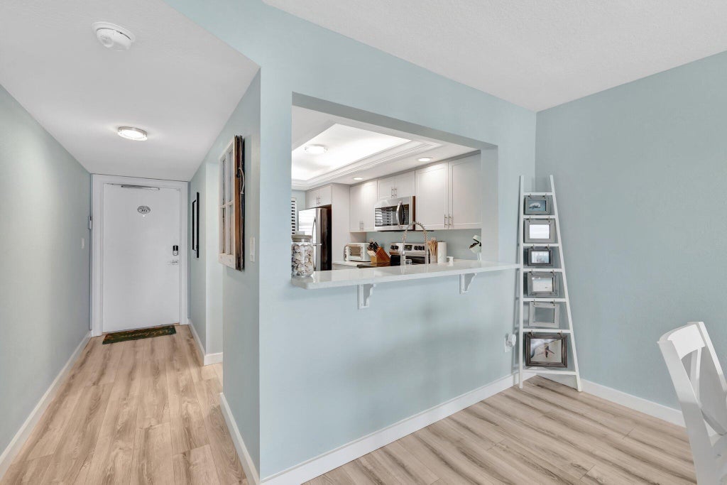 Photo of 10310 S Ocean Drive #305, Jensen Beach, FL 34957 (MLS # B26038796)