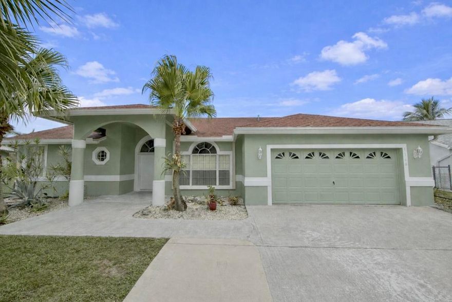 You'll absolutely love this beautifully upgraded home nestled within a desirable gated community in Greenacres. Enjoy peace of mind with a 2021 roof, an A/C under 4 years old, full hurricane protection, and a low HOA. The modernized kitchen shines with stylish finishes and flows seamlessly into bright, open living spaces overlooking tranquil water views. Each bedroom features its own ensuite bath, offering comfort and privacy for family and guests alike. Perfectly blending upgrades, security, and serene surroundings—this move-in-ready home is a rare find.