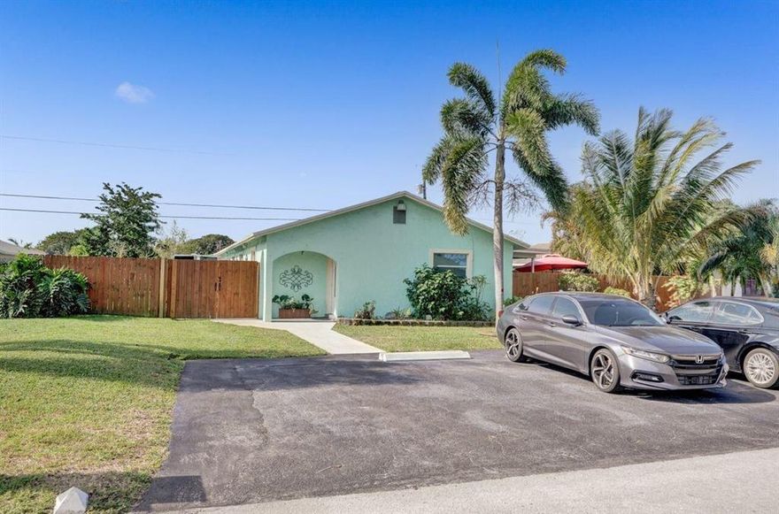 This is actually a Duplex with 2 bedrooms, 1 bath on one side and 3 bedrooms, 1 bath on the other. Perfect for Multi-Generational living or live in one side and rent the other. Impact windows, custom lighting, granite, outdoor kitchen and tons more! This home has fantastic space inside and a ton of outdoor living options!