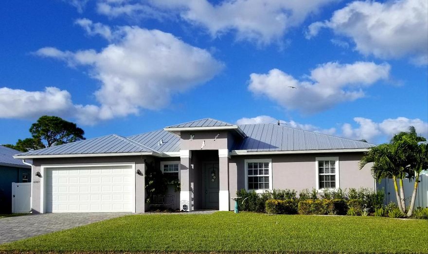Stunning Key West NEW CONSTRUCTION.  Open floor plan with custom coffered 10' ceilings and 8' doors. Open floor plan, kitchen island with granite counters and 42'' custom white Shaker cabinets. 3 bedrooms, large Master bedroom with walk-in closet. High-end faucets and fixtures. All windows are hurricane impact glass. Oversized 2-car garage. Automatic sprinkler. Upgraded extended width driveway. Room for pool in backyard.