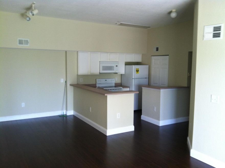 Move in ready! This 2/2 features wood laminated floor. Washer and Dryer in separate laundry room off kitchen. There is a separate locker storage room outside the front door. Unit will be professionally cleaned prior to final walk through. Unit is vacant and very easy to show. First, last and security required for move in. If you decide to apply, send proof of income, screenshot of credit score and copy of ID. Gated community with Clubhouse, pool, fitness center, picnic area and child playground. Must to see!!!