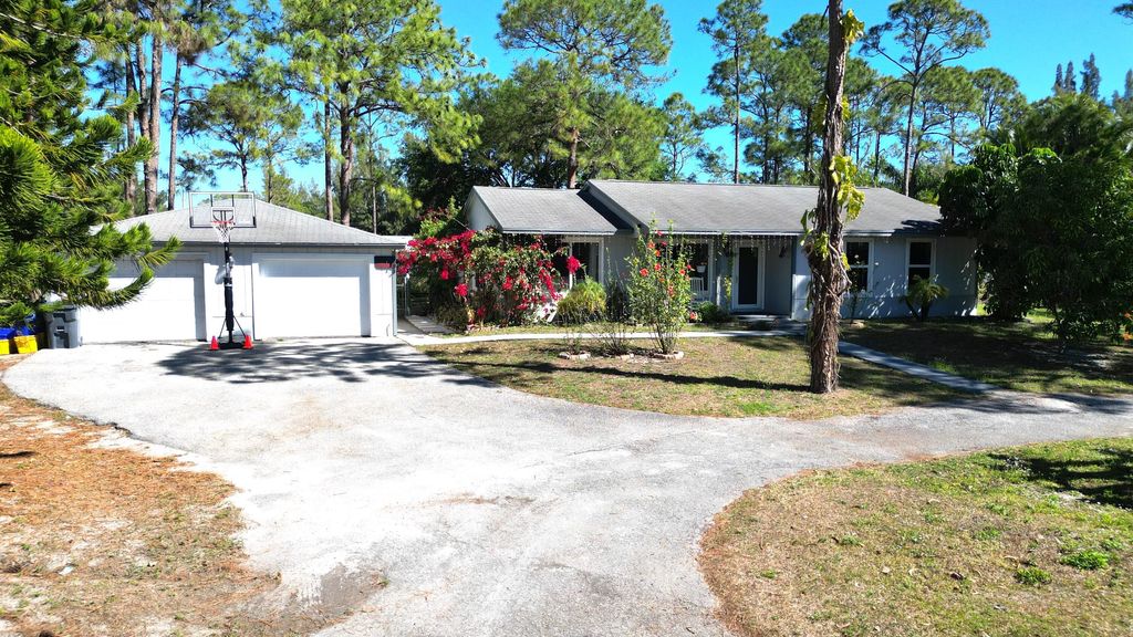 Photo of 13619 57th Place N, West Palm Beach, FL 33411 (MLS # B26010044)