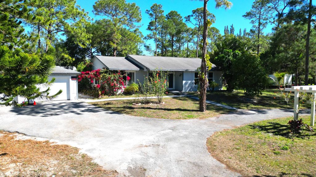 Photo of 13619 57th Place N, West Palm Beach, FL 33411 (MLS # B26010044)