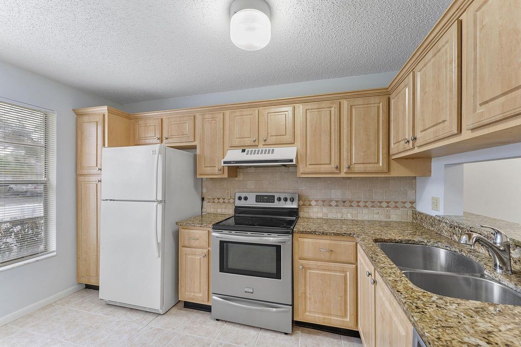 Photo of 115 Oakwood Drive, Jupiter, FL 33458 (MLS # R11065876)