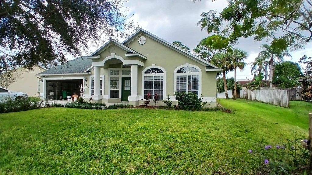 Photo of 2509 SW Abney Street, Port Saint Lucie, FL 34953 (MLS # R11037938)