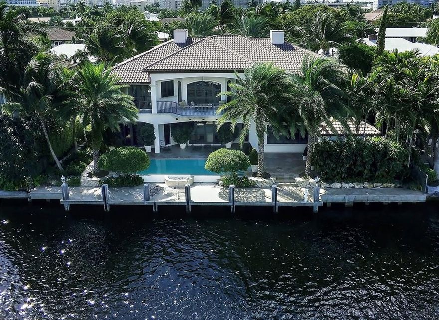 Prime location one of the most desirable & valuable isles. Walking distance to Country Club. Surrounded by multi-million dollar properties.Highly upgraded including $100k home technology. Incredible floorplan offers potential 2 bedroom suites or theatre first level. Elegant formal entertaining areas, open family room & Chef's island kitchen,Subzero, etc. Marble & hardwood flooring. Summer Kitchen & dining loggia. Loft den. Ultra luxurious master suite with his/her closets & baths. Impact glass & generator