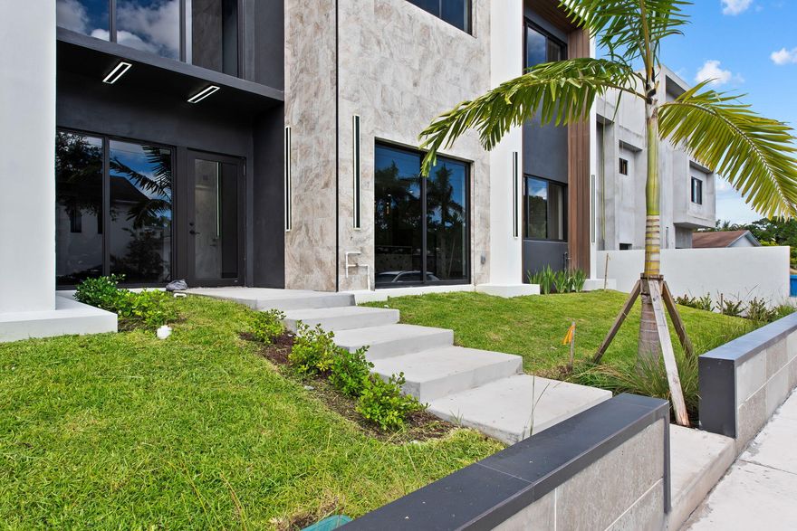 Welcome to Eight at Croissant Park—an exclusive new construction townhouse in one of Fort Lauderdale's most desirable neighborhoods, just minutes from Downtown Fort Lauderdale, Las Olas, dining, and entertainment. This residence offers approximately 4,200-4,600 total sqft with open-concept living, high ceilings, and abundant natural light. The chef's kitchen features premium appliance options and flows seamlessly into the main living and dining areas. The primary suite offers a spa-inspired bath designed for comfort and relaxation. Enjoy indoor-outdoor living with a private yard and an expansive ~1,100 sqft rooftop terrace, perfect for entertaining, with optional summer kitchen and panoramic city views. Upgrade options include a wading pool and high-end appliance packages.