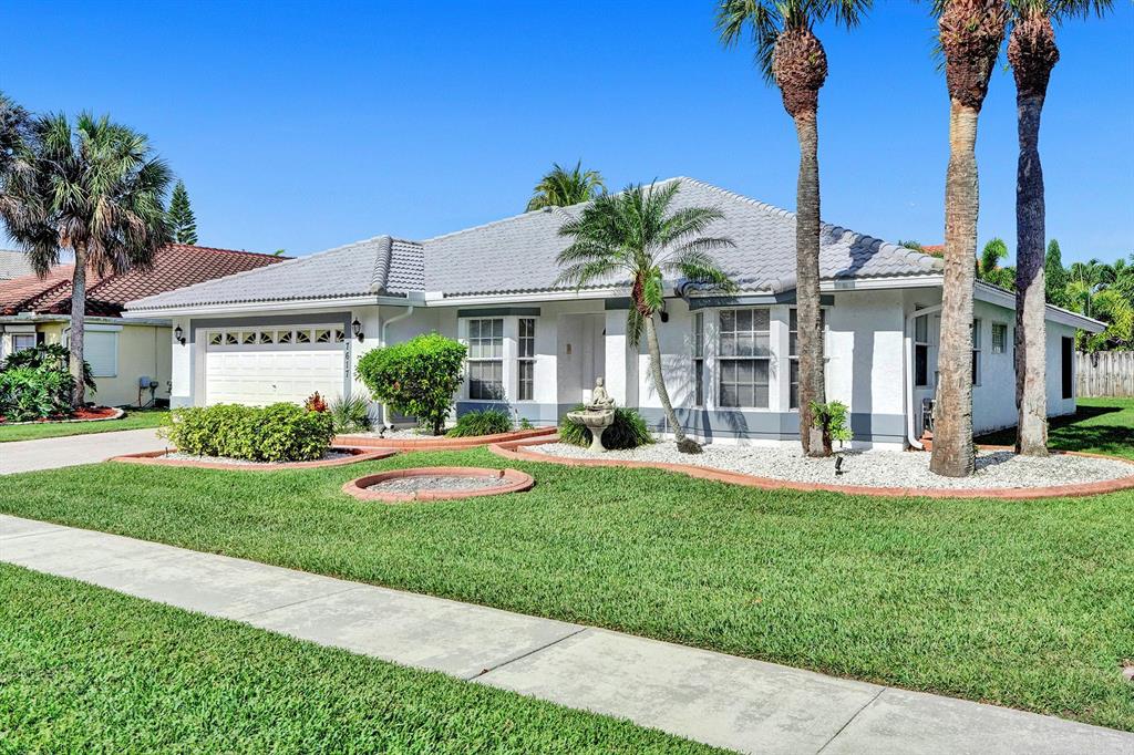 Photo of 7617 Briar Cliff Circle Cir, Lake Worth Beach, FL 33467 (MLS # R10712854)