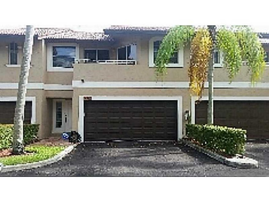 Beautiful 4 bedroom 2 1/2 bath townhome with a 2 car garage in Coral Springs completely updated. This property features tile flooring downstairs, wood floors in guest bedrooms and upstairs hallway. The kitchen features beautiful mocha colored cabinets, mo saic tile backsplash, granite counter tops and stainless steal appliances. Beautiful breakfast bar. And large dining room. Master bedroom has a large walk in closet, master bath has double vanity and large shower. NOT CONTIGENT UPON APPRASIAL NO FHA