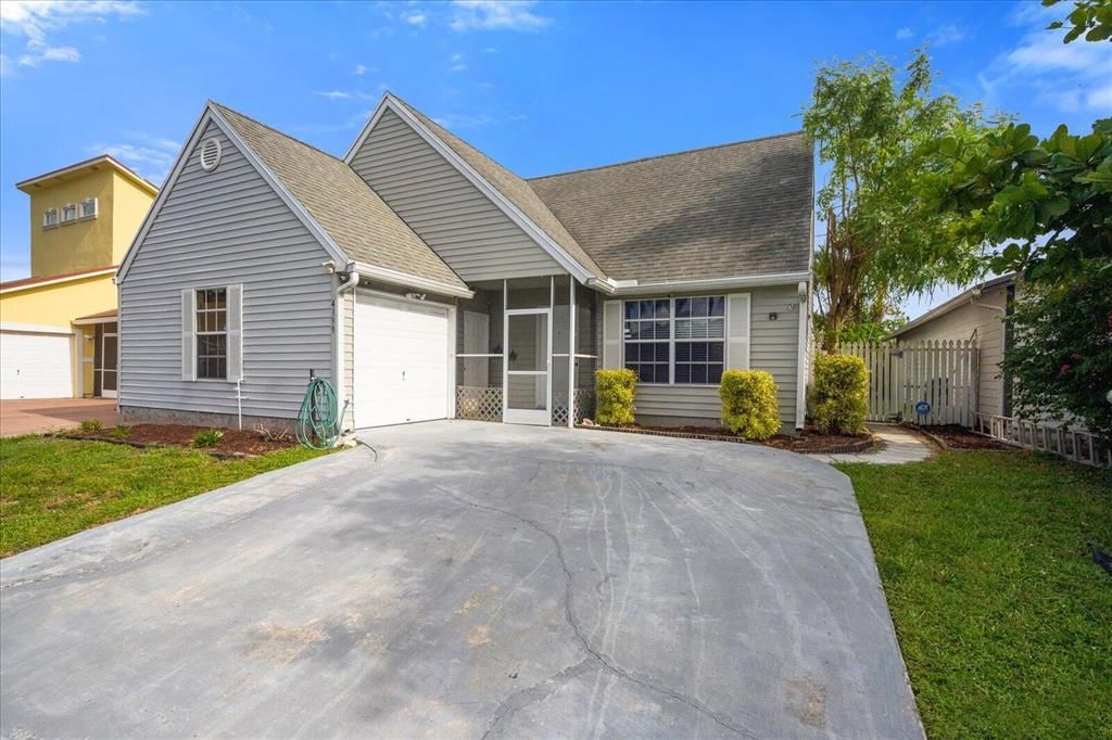 Photo of 4199 Willowood Lane Ln, Lake Worth Beach, FL 33462 (MLS # R10827199)