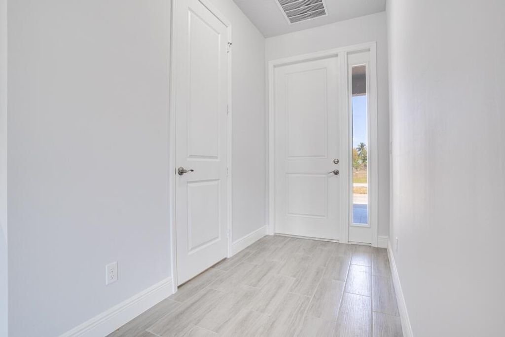 Photo of 802 SW Harvard Road, Port Saint Lucie, FL 34953 (MLS # R10913389)