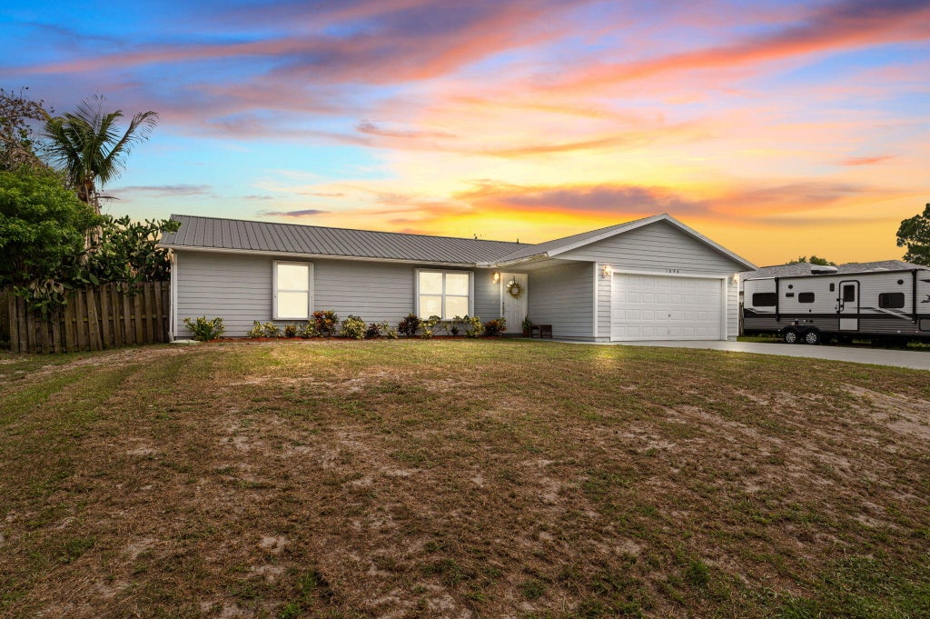 Photo of 1098 SW Janette Avenue, Port Saint Lucie, FL 34953 (MLS # B26051604)