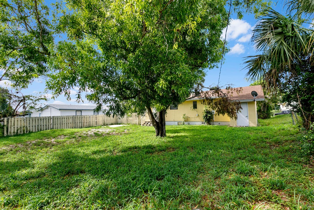 Photo of 1464 W 32ND Street, Riviera Beach, FL 33404 (MLS # B26067211)