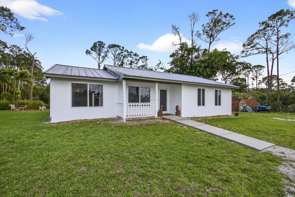 Photo of 12944 N 68th St Street N, The Acreage, FL 33412 (MLS # B26010864)