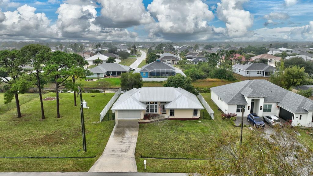 Photo of 2568 SW Fairgreen Road, Port Saint Lucie, FL 34953 (MLS # R11056295)
