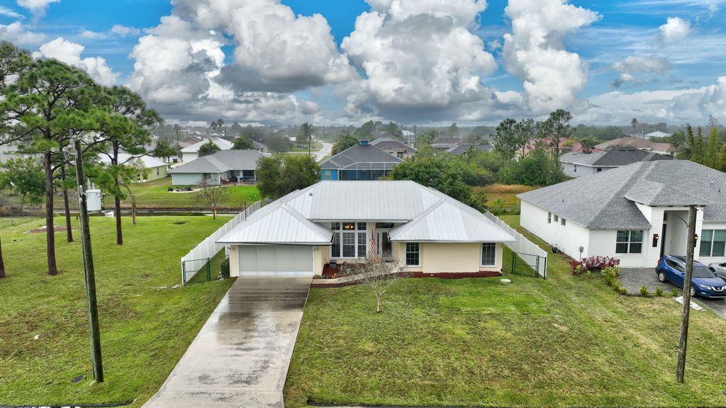 Photo of 2568 SW Fairgreen Road, Port Saint Lucie, FL 34953 (MLS # R11056295)