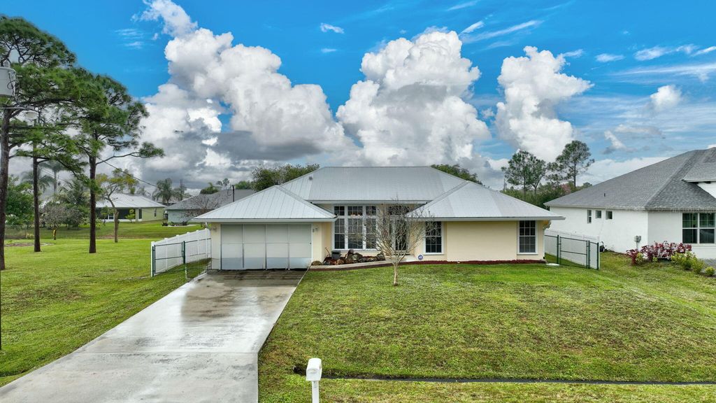 Photo of 2568 SW Fairgreen Road, Port Saint Lucie, FL 34953 (MLS # R11056295)