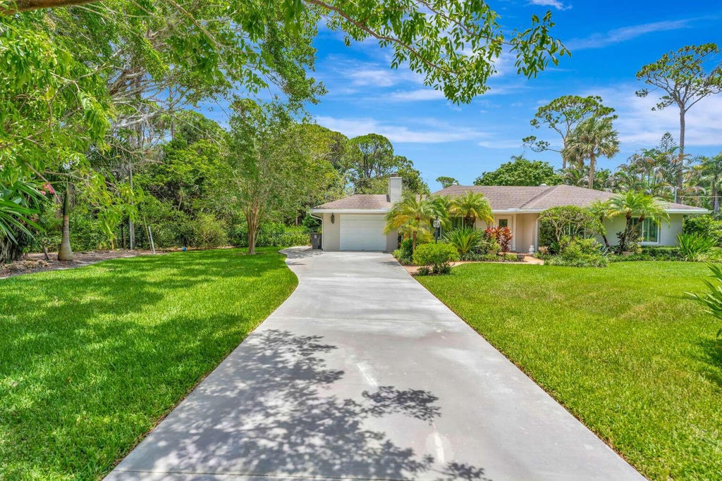 Photo of 5531 HIBISCUS Road, Jupiter, FL 33458 (MLS # B26069882)
