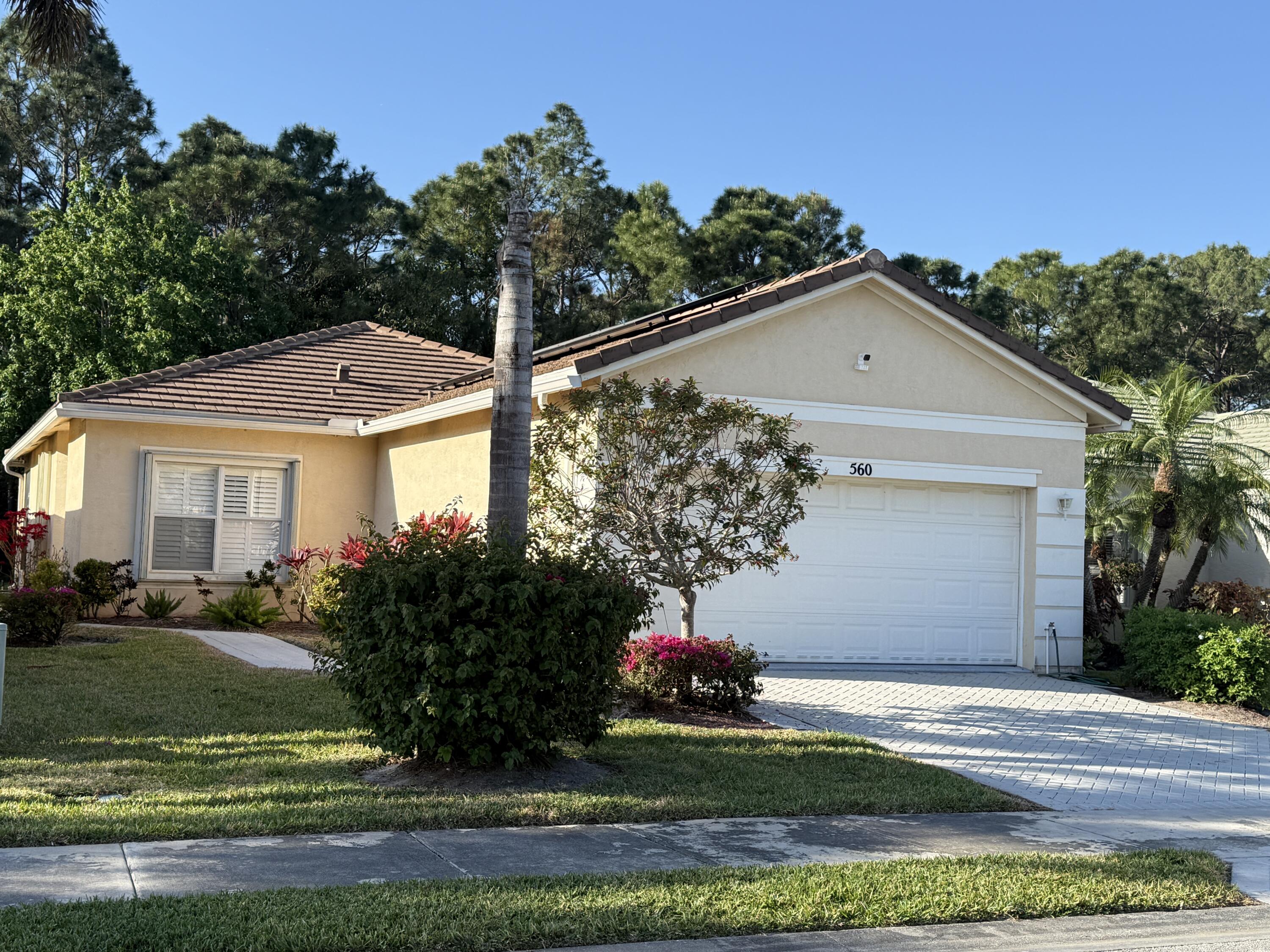 Recently renovated, 2 bed with a den, located in the heart of St Lucie West with a preserve in back.Tile Roof 5 years old. New tile floors in bedrooms, Freshly painted. Electric solar panels keeping electric bill at $178 monthly and back up battery power in case of storm. Open floor plan with plenty of sunshine throughout with plantation shutters covering all the windows. New SS appliances and granite counters. Wheelchair assessable in master bath with concrete ramp in garage. Located just minutes from major highways, shopping, dining & medical facilities. Gated community with heated pools and club house. The HOA's are the lowest in the area and it includes landscaping and community amenities. Home looks brand new! Don't miss out.