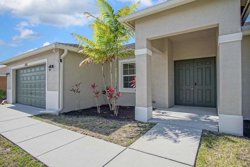 Photo of 1062 SW Romaine Lane, Port Saint Lucie, FL 34953 (MLS # R11087831)