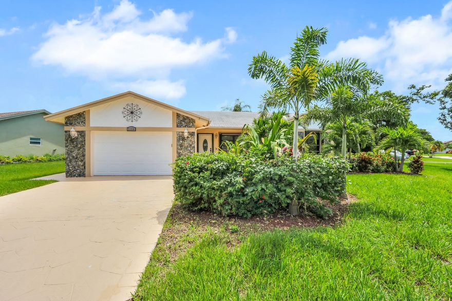 Come see this amazing home in 55+ Isles of Tamarac.  This beautiful and well maintained 2/2 with garage sits on a large oversized lot. The home also has an extended oversized driveway as well as an updated kitchen with stainless steel appliances, recessed lighting throughout, crown molding, accordion shutters and tile in all rooms except master bedroom. The large and private covered back patio is perfect for entertaining or just enjoying the day in your own private area. The community also has a Club House with pool, tennis courts and shuffleboard. Come see this today!