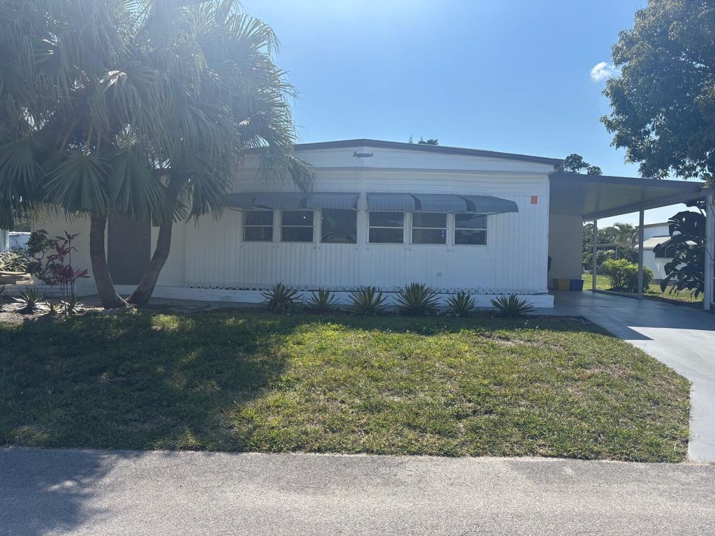 Photo of 6445 Cypress Lane, Atlantis, FL 33462 (MLS # B26024148)