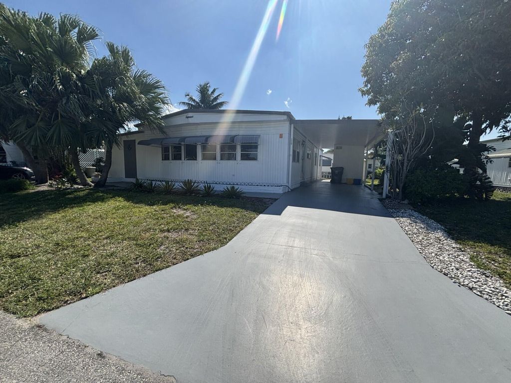 Photo of 6445 Cypress Lane, Atlantis, FL 33462 (MLS # B26024148)