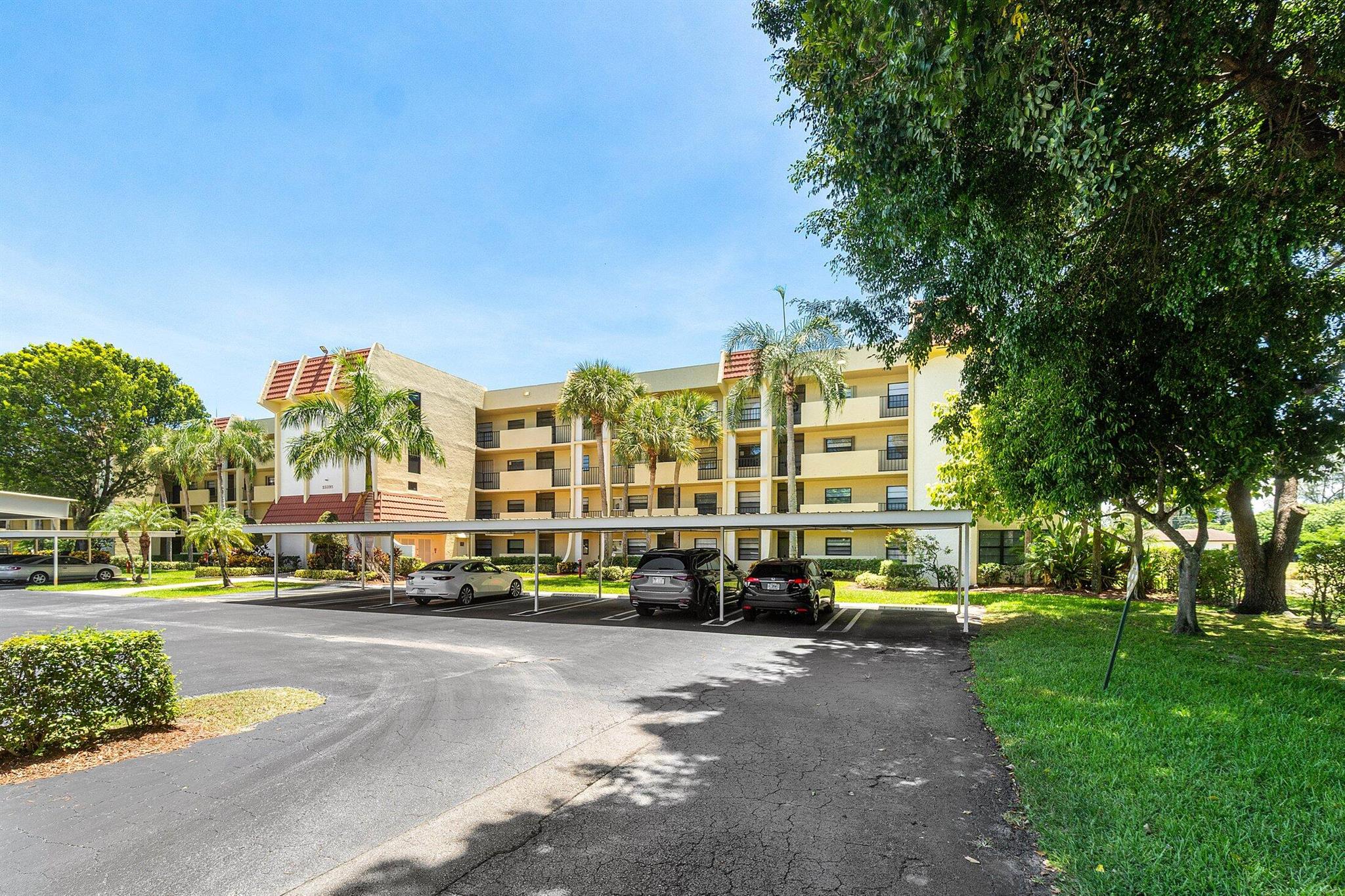 Beautiful all-ages condo in the desirable Pines at Boca Barwood featuring vinyl flooring throughout. Spacious layout with two large bedrooms, each with its own ensuite bathroom. The primary suite offers balcony access and a generous walk-in closet. Large Screened in patio with Canal views. Enjoy the convenience of a full-size washer and dryer, covered parking, and a building elevator. Relax with tranquil canal views and take advantage of the well-maintained grounds. The community offers exceptional amenities, including a clubhouse, fitness center, pool, gym, and more. Cable, building insurance and water included in the condo fee. Zoned for excellent schools. No rentals allowed.