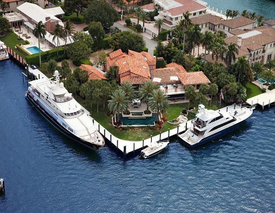 Most incredible views & one of the largest point Estates in the city! 200 ft of Estelle River (400 total) accommodates large/multi yacht dockage without obstructing views. Built by Miller Estate Homes, the residence has an inviting island ambiance & superb entertaining areas. All modern luxury amenities, impact windows & doors + generator. Majority of expansive rooms feature waterfront views. Impeccably maintained. Vaulted & higher ceilings. Extensive loggias & balconies. Resort style grounds.