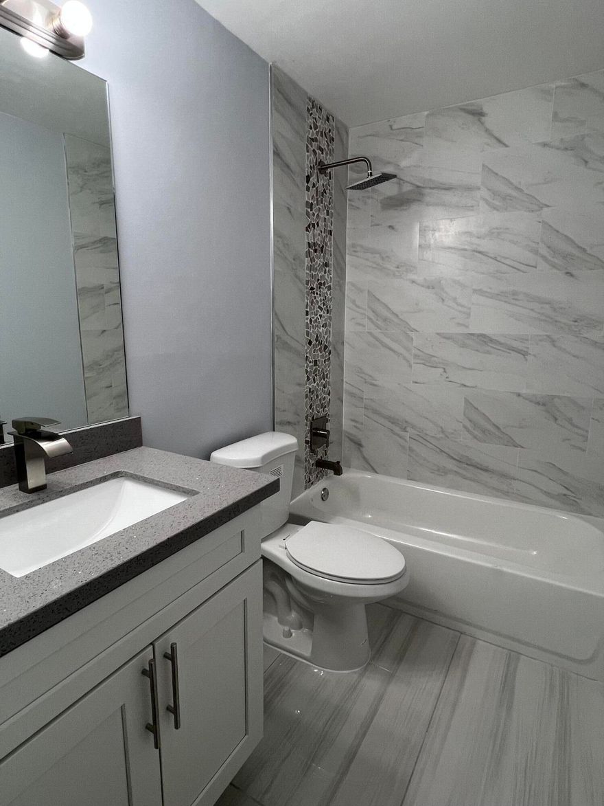 3-bed/2-bath corner townhome with a covered patio and fenced backyard, offering boat parking. This single-story gem is completely modernized and updated, boasting a wood kitchen with granite countertops, stainless steel appliances, fresh paint, porcelain tile flooring throughout, renovated bathrooms with dual sinks in the master, and a spacious walk-in closet. Conveniently situated in the heart of Dania Beach, with a quick approval process. This prime location is near shopping, dining, and transportation ***Available Immediately***