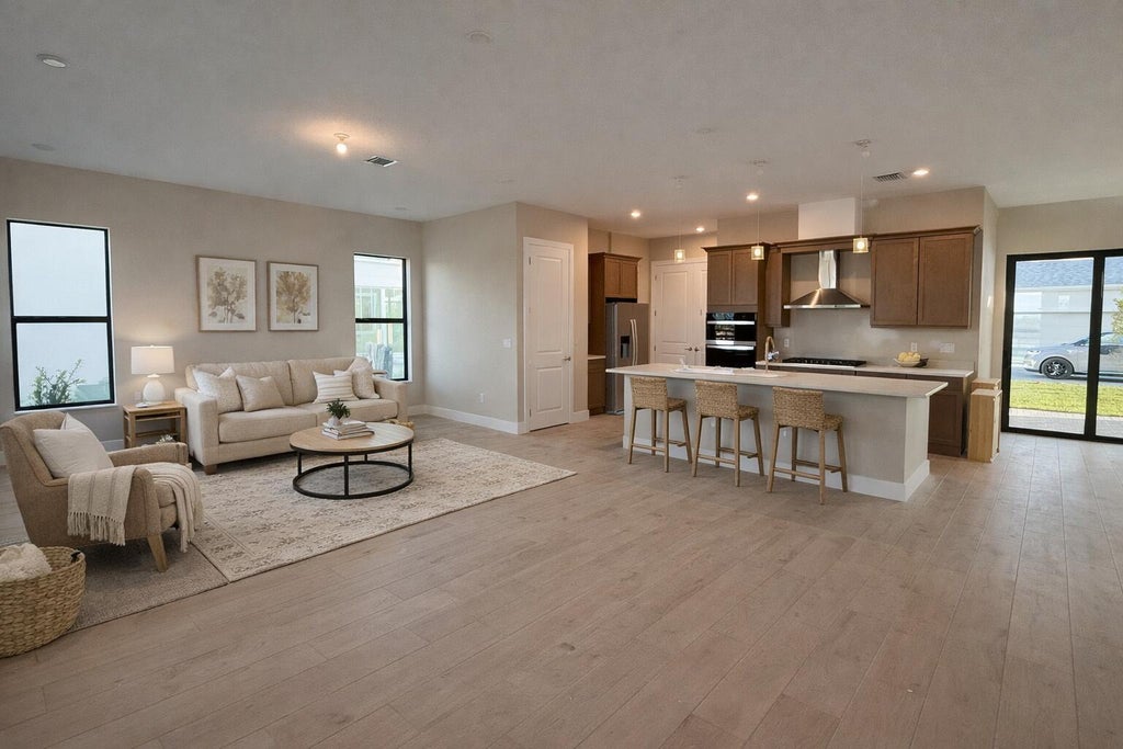 Photo of 10910 SW Pioneer Parkway, Palm City, FL 34990 (MLS # B26063327)