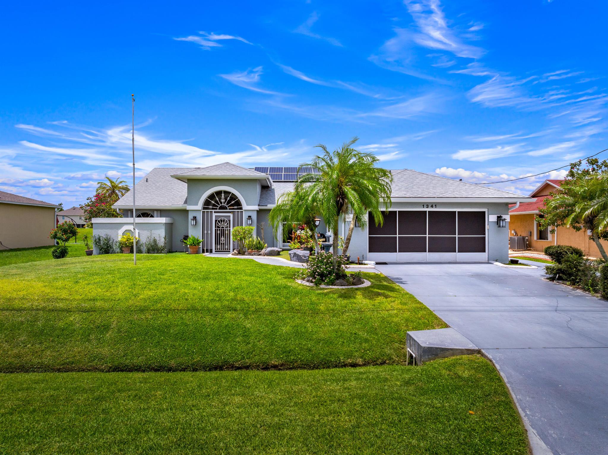 Canal-Front Pool Home in Port St. Lucie Get ready to fall in love with this beautifully maintained home offering over 2,000 sq ft under air and packed with features made for Florida living! Enjoy a screened-in pool, spacious under-truss patio with summer kitchen, and direct access to the C-24 Canal with a private deck and dock--complete with water, electric, and lighting. Inside, you'll find soaring vaulted ceilings, a granite kitchen with stainless appliances, and tons of natural light. sprinkler system. -Accordion hurricane shutters- Cabana bath & Roman tub-Peaceful waterfront setting-Conveniently located near schools, shops, and parks.