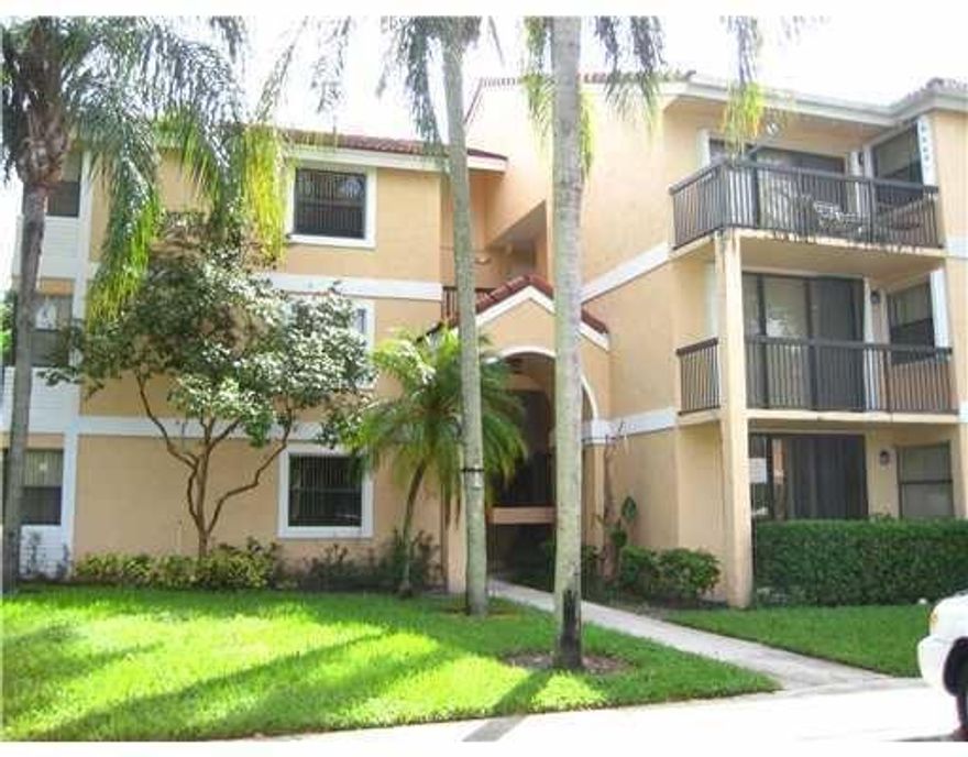BEAUTIFUL 2 bedroom, 2 bathroom, 2nd floor condo on water in desirable Grand Oasis, right on the Parkland border! Brand new gorgeous wide-plank vinyl-wood flooring throughout, spacious wood kitchen, granite counter tops, large walk-in closet in the primary bedroom, large balcony, and great **LARGEST** split bedroom floor plan! Community has pool, hot tub, tennis, and gym. Small pet okay and fast association approval! Available immediately!