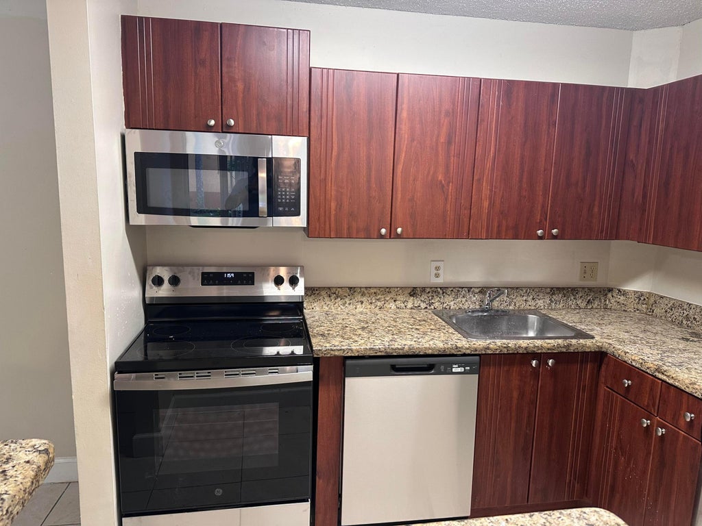 Photo of 10773 CLEARY Boulevard #110, Plantation, FL 33324 (MLS # B26064997)