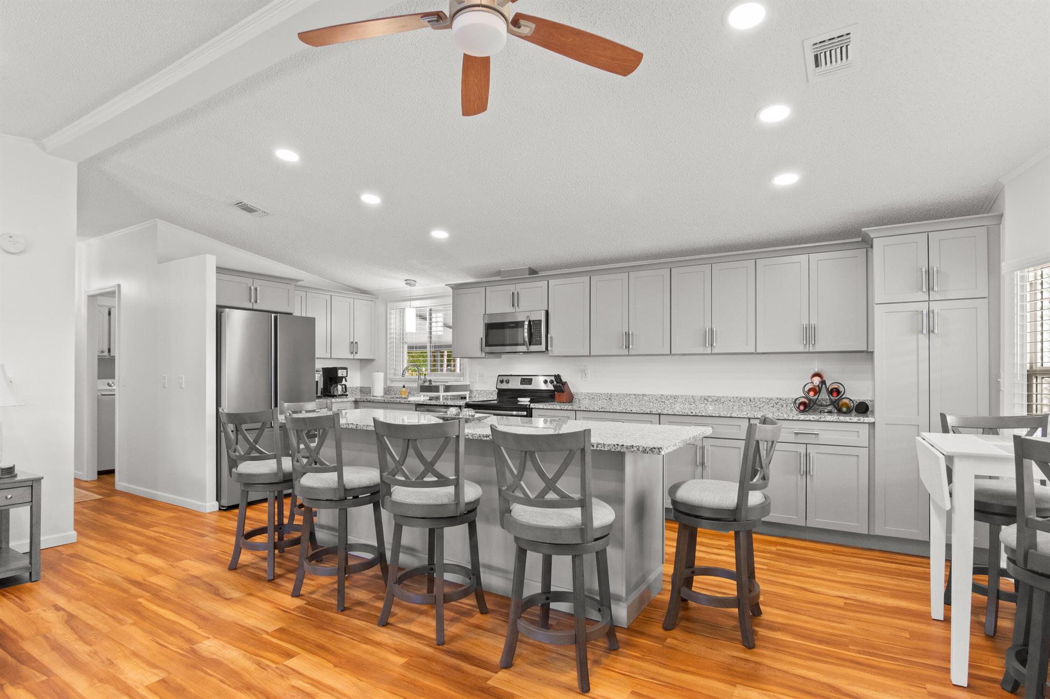 Beautifully remodeled, turn-key, and move-in ready, this home feels brand new inside! A rare find in Savanna Club--you OWN the land, no land lease--offering lasting value. Enjoy the premier 55+ resort lifestyle with an 18-hole golf course, pro shop, performing arts center, grand lobby, restaurant, tennis & pickleball courts, 3 fitness centers, 3 heated pools & spas, libraries, computer center, bocce, shuffleboard, billiards, indoor basketball, softball, boat/RV storage, ballroom, arts & crafts, theater, card rooms, horseshoes, saunas, and endless events.