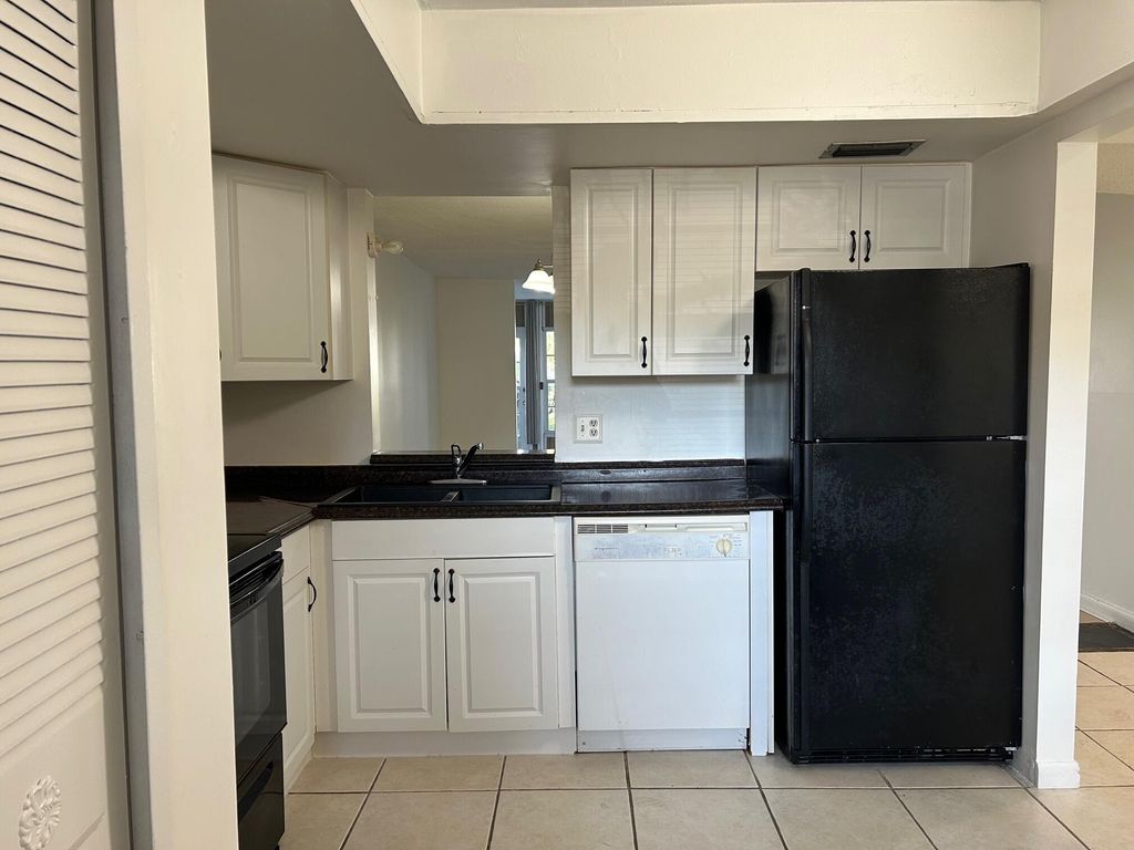 Photo of 25 Abbey Lane #104, Delray Beach, FL 33446 (MLS # R11165677)