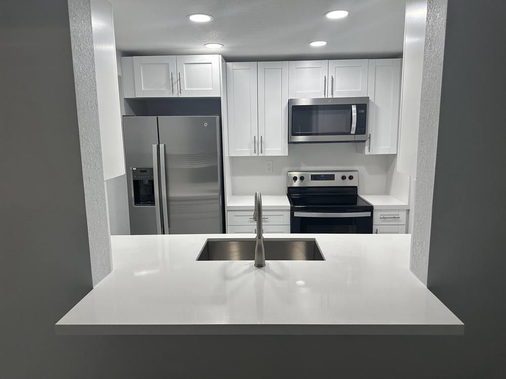 Photo of 9430 Boca Cove Circle #203, Boca Raton, FL 33428 (MLS # R10888312)