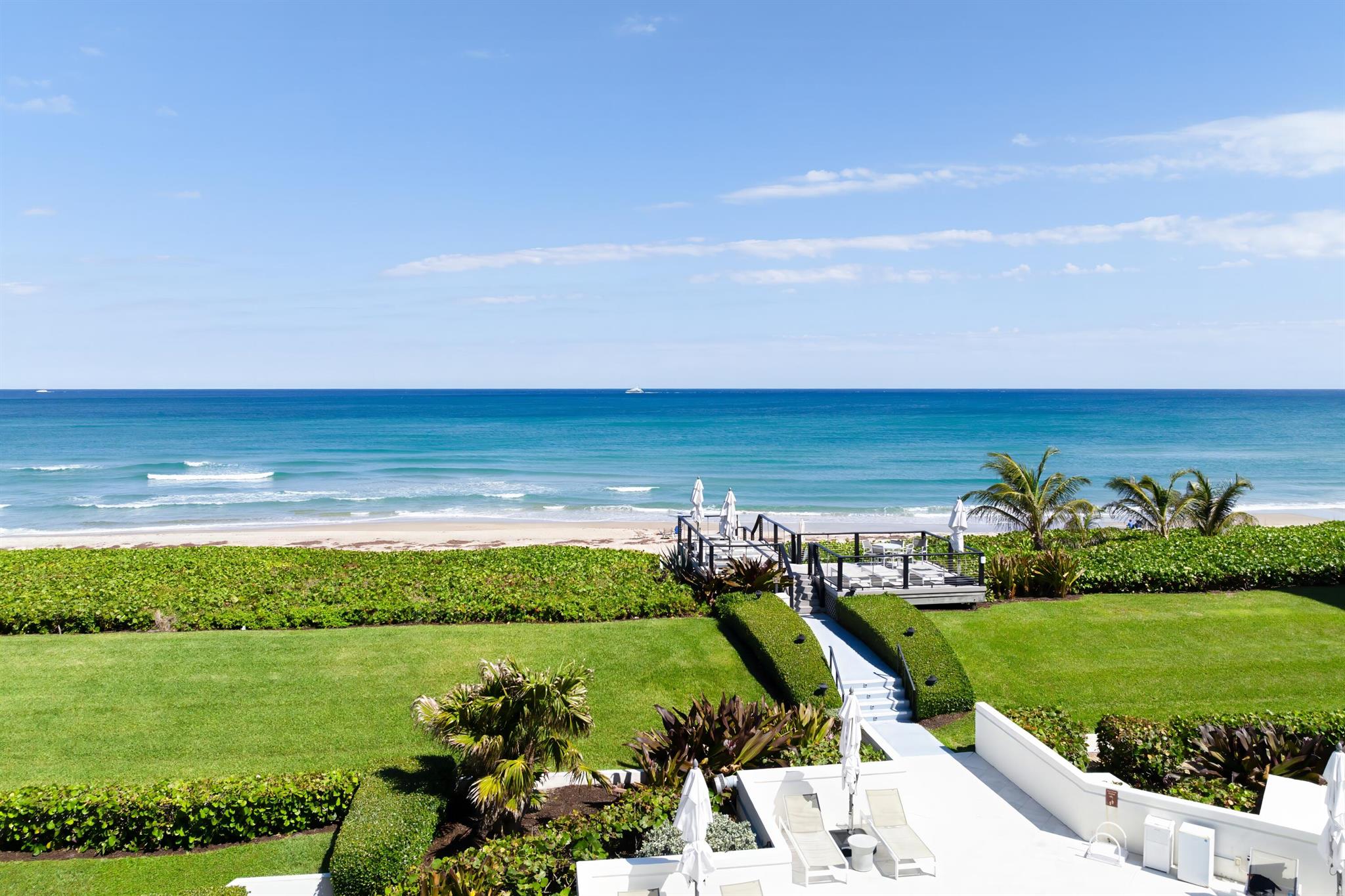 Experience unapparelled resort style luxury in this elegant penthouse in Palm Beach. This corner unit offers stunning views of the Atlantic Ocean and the Intracoastal Waterway. With only two units on this floor, enjoy ultimate privacy and tranquility. With 2,497 sq. feet, this sophisticated 2-bedroom, 2 .5 bath residence features 9-foot ceilings, gleaming hardwood floors and three balconies. The beautifully updated kitchen has Thermador appliances and an island for eating. The updated kitchen and bathrooms add a modern touch to this coastal retreat. Enjoy the convenience of an in-unit laundry room. Included in the sale is a large boat slip accommodating a vessel up to 40 feet.