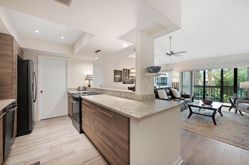 Photo of 11863 Wimbledon Circle #542, Wellington, FL 33414 (MLS # B26027648)