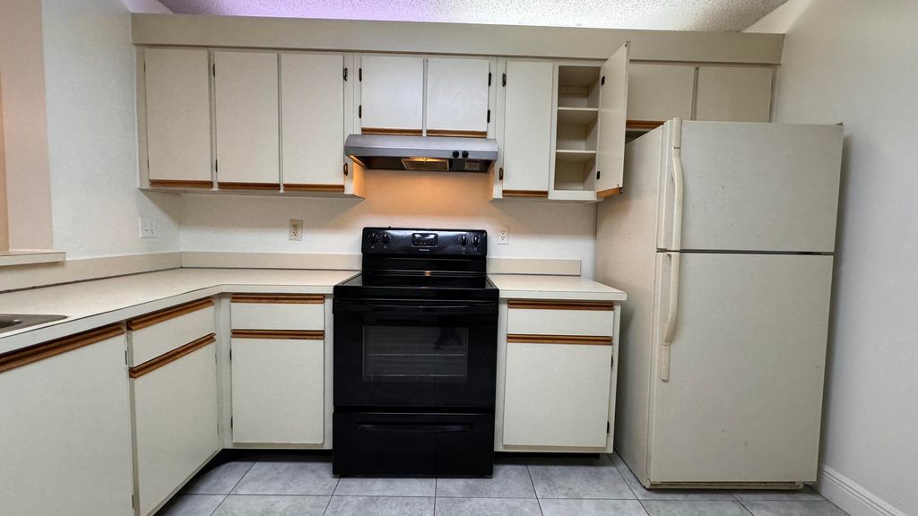 Photo of 5641 Riverside Drive #103b1, Coral Springs, FL 33067 (MLS # R11021401)