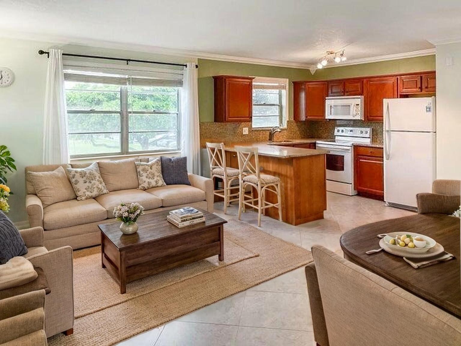 Updated CORNER unit with rare in-unit washer and dryer. located in Century Village, a gated 55+ community offering 24/7 security, shuttle service, and a 92,000 sq. ft. clubhouse with a 1,200-seat theatre, live shows, fitness center, pools, tennis, pickleball, bocce, and more. Just 9 miles from the ocean, 5 miles to PBI Airport, and minutes to shopping, dining, and cultural venues.