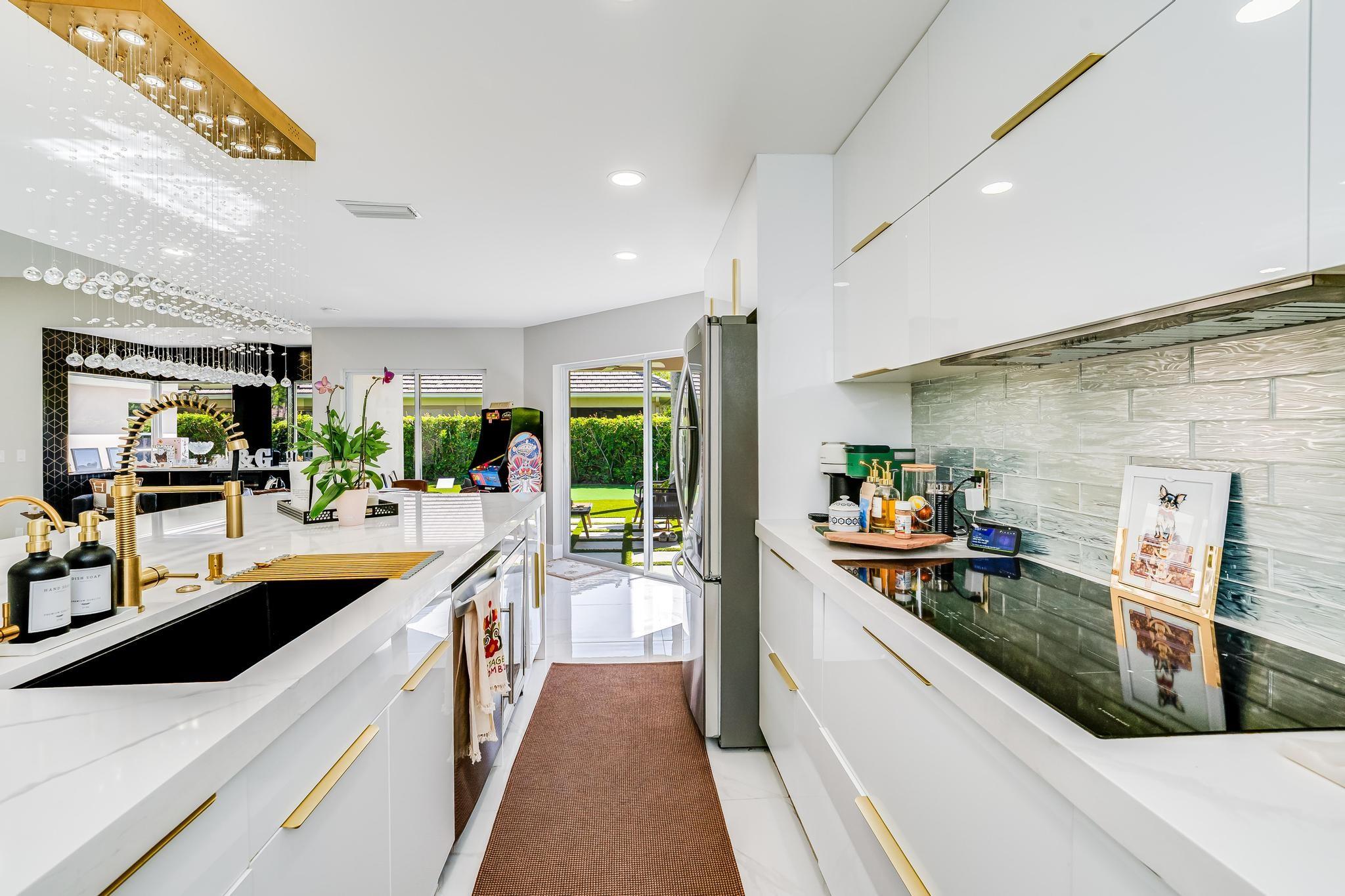 Located on a corner lot in PGA, this updated 3BR/3BA home offers charm, privacy, and modern comfort. Vaulted ceilings and an open layout create a bright, airy feel with seamless flow between living, dining, and kitchen spaces. The gourmet kitchen features quartz countertops, stainless steel appliances, and ample cabinetry—perfect for entertaining. Enjoy a fully turfed backyard ideal for relaxing or practicing your short game. Set in a quiet, well-landscaped neighborhood within a premier golf community, this home blends luxury and lifestyle effortlessly.