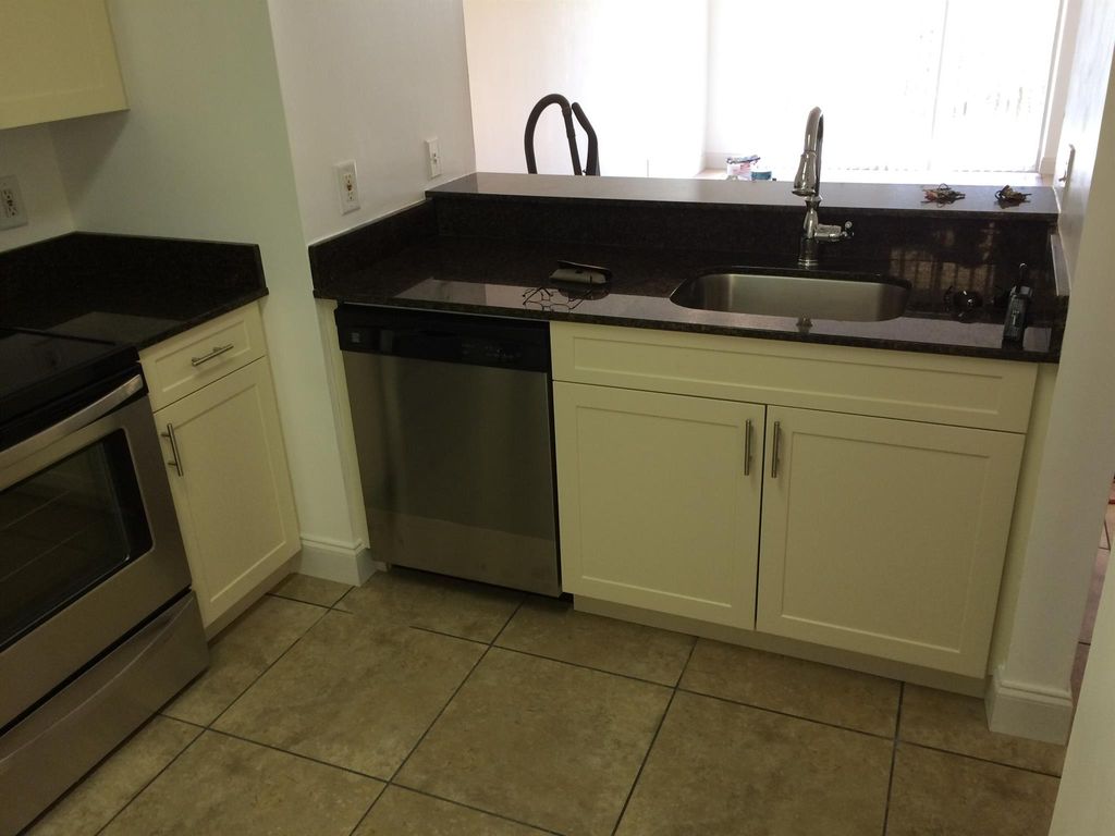 Photo of 1020 Lake Shore Drive #103, Lake Park, FL 33403 (MLS # R11072766)