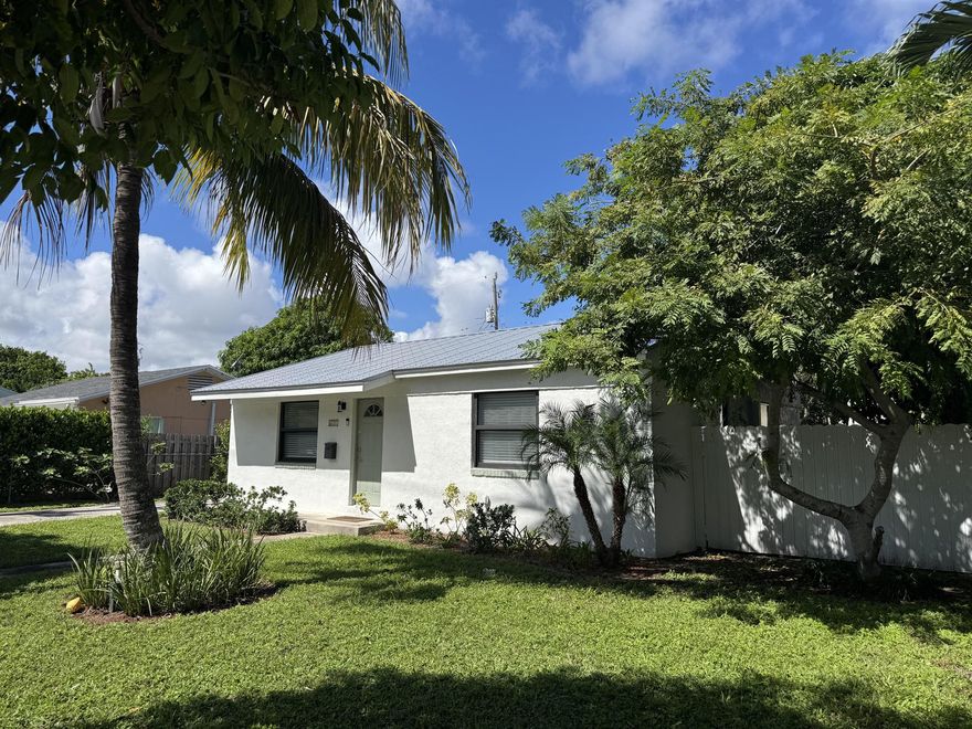 Discover 611 Monceaux Rd - a fully renovated 3 bedroom/2 bathroom gem in one of West Palm's most desirable neighborhoods. Just minutes from downtown, the Intercostal, and Palm Beach island, this home offers the perfect mix of charm, location and investment potential. Enjoy an open, sun-filled layout with modern kitchen, stainless steel appliances, granite counters, impact windows, and a new metal roof, new washer and dryer. The fenced-in backyard is a private tropical retreat with fruit trees and room for pool. Close to beaches, shops, restaurants, the Kravis Center, and Brightline train - this home is move-in ready and full of opportunity.