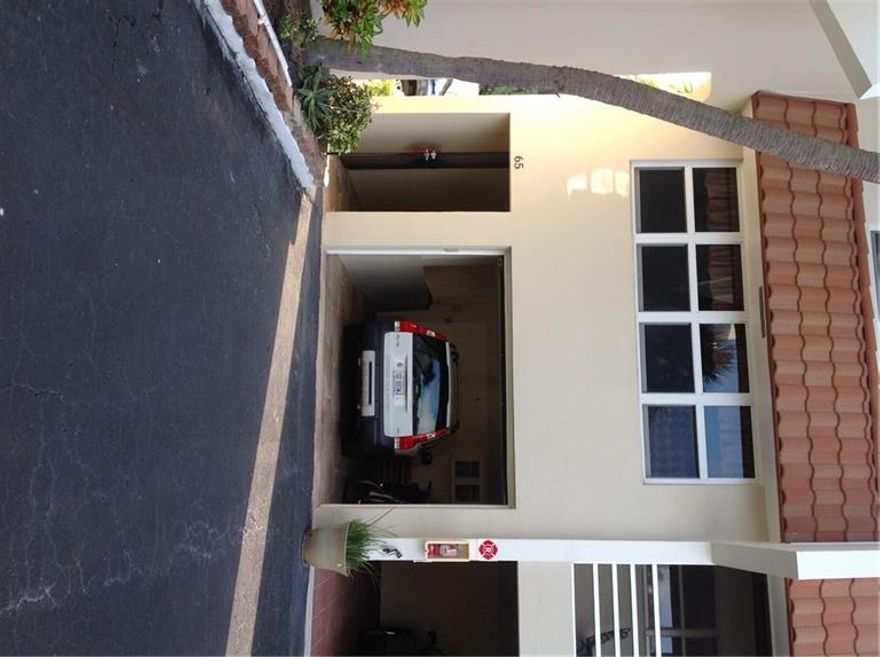 This beautiful tri-level townhouse, located in the highly desirable town of Lauderdale by the Sea, is nestled between the Atlantic Ocean and and the Intra Coastal Waterway. Easy walk to beach.  Volume ceiling in Living room with hurricane resistant windows and doors providing natural light. Balcony leads to a private, park-like fenced-in back yard.  Updated kitchen features large preparation area and breakfast counter.  Master bedroom balcony provides views of beautifully landscaped Sea Ranch Lakes.