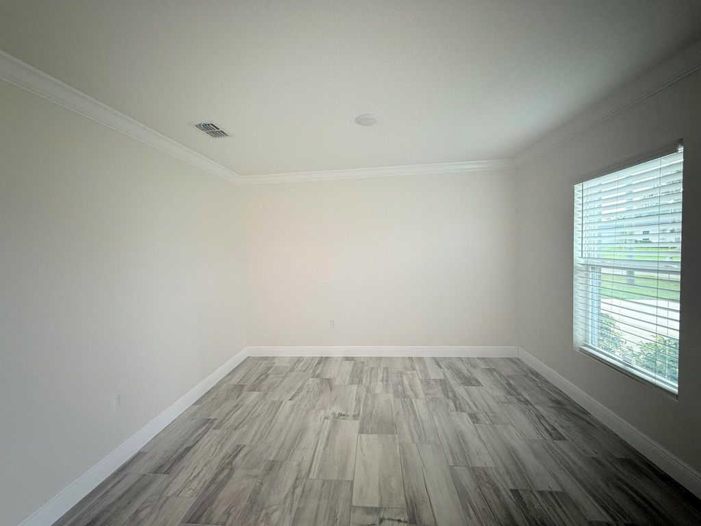 Photo of 1062 SW Sudder Ave, Port Saint Lucie, FL 34953 (MLS # R11039689)
