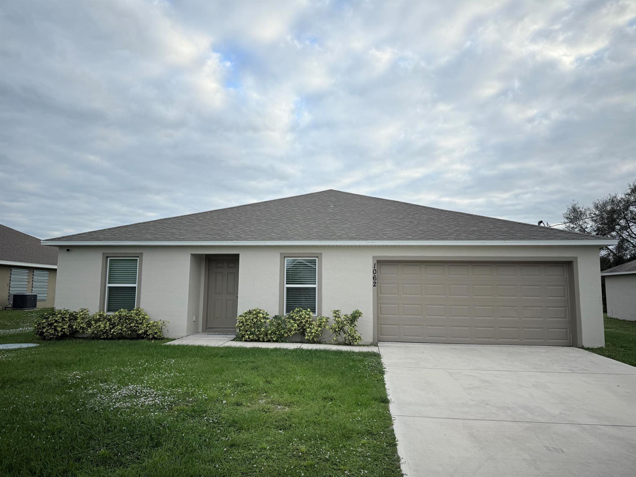 This pristine, move-in-ready home, built in 2020, offers modern living in the desirable Port St. Lucie area! Featuring 4 spacious bedrooms and 2 bathrooms, this home is perfect for families seeking a stylish. Enjoy an open-concept living and dining area, a thoughtful split floor plan, and a large backyard ideal for outdoor activities. The property also includes a 2-car garage and comes with valuable services like lawn care, pest control, and pressure washing up to 2 times a year. NO HOA, you'll appreciate the freedom and convenience of this quiet, well-established neighborhood, just minutes from shopping, dining, top-rated schools, and major highways. Apply today!