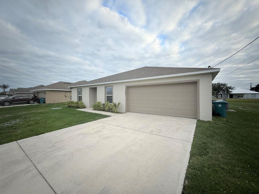 Photo of 1062 SW Sudder Ave, Port Saint Lucie, FL 34953 (MLS # R11039689)