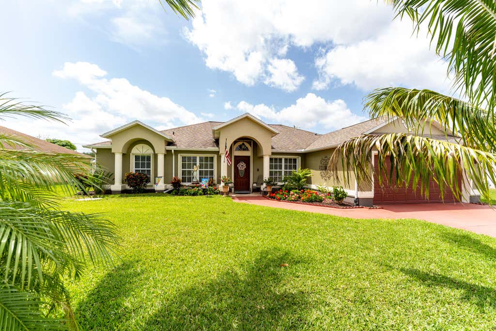 Photo of 702 SW Haas Avenue, Port Saint Lucie, FL 34953 (MLS # R10793888)